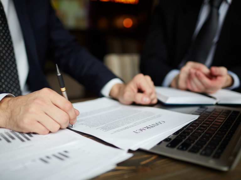 businessman-reading-contract-closeup businessman-reading-contract-closeup