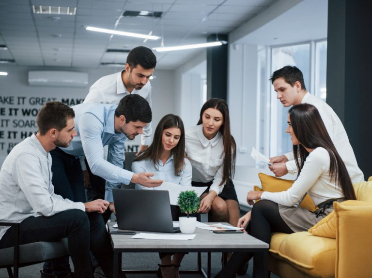 guy-shows-document-girl-group-young-freelancers-office-have-conversation-working guy-shows-document-girl-group-young-freelancers-office-have-conversation-working